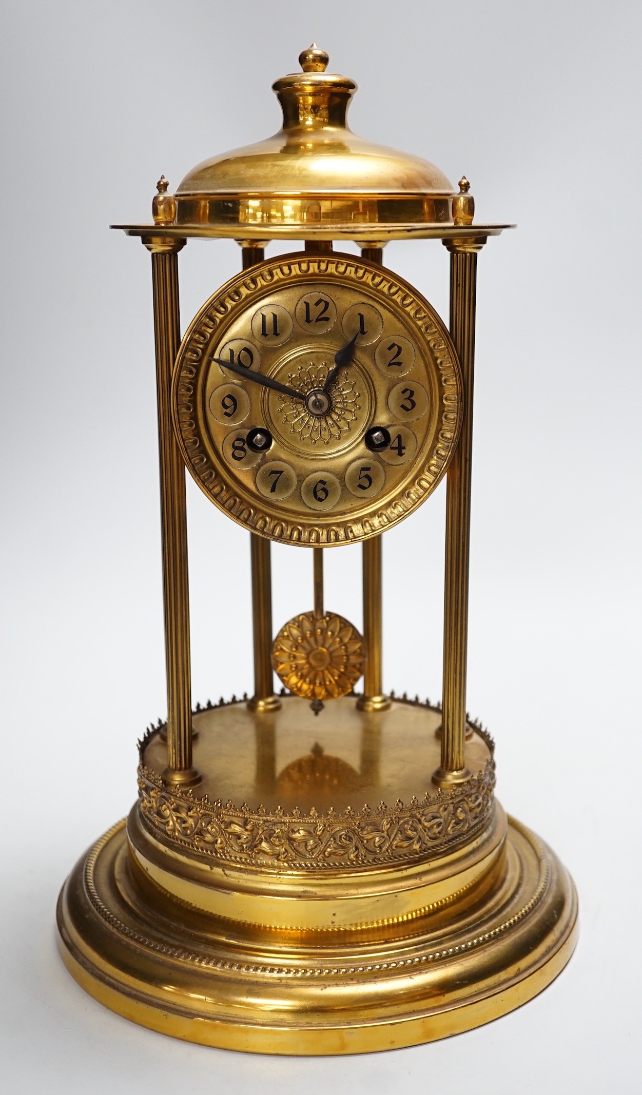 An early 20th century gilt brass pedestal mantel clock, 36cm